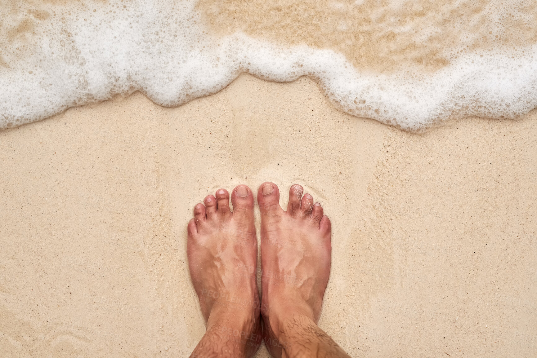 Buy stock photo High angle shot of a man's feet at the beach