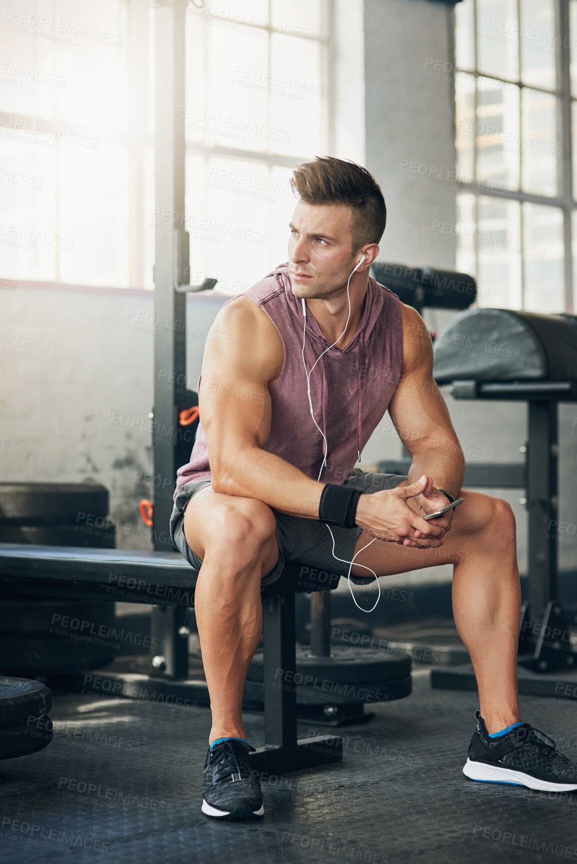 Buy stock photo Shot of a handsome young man at the gym