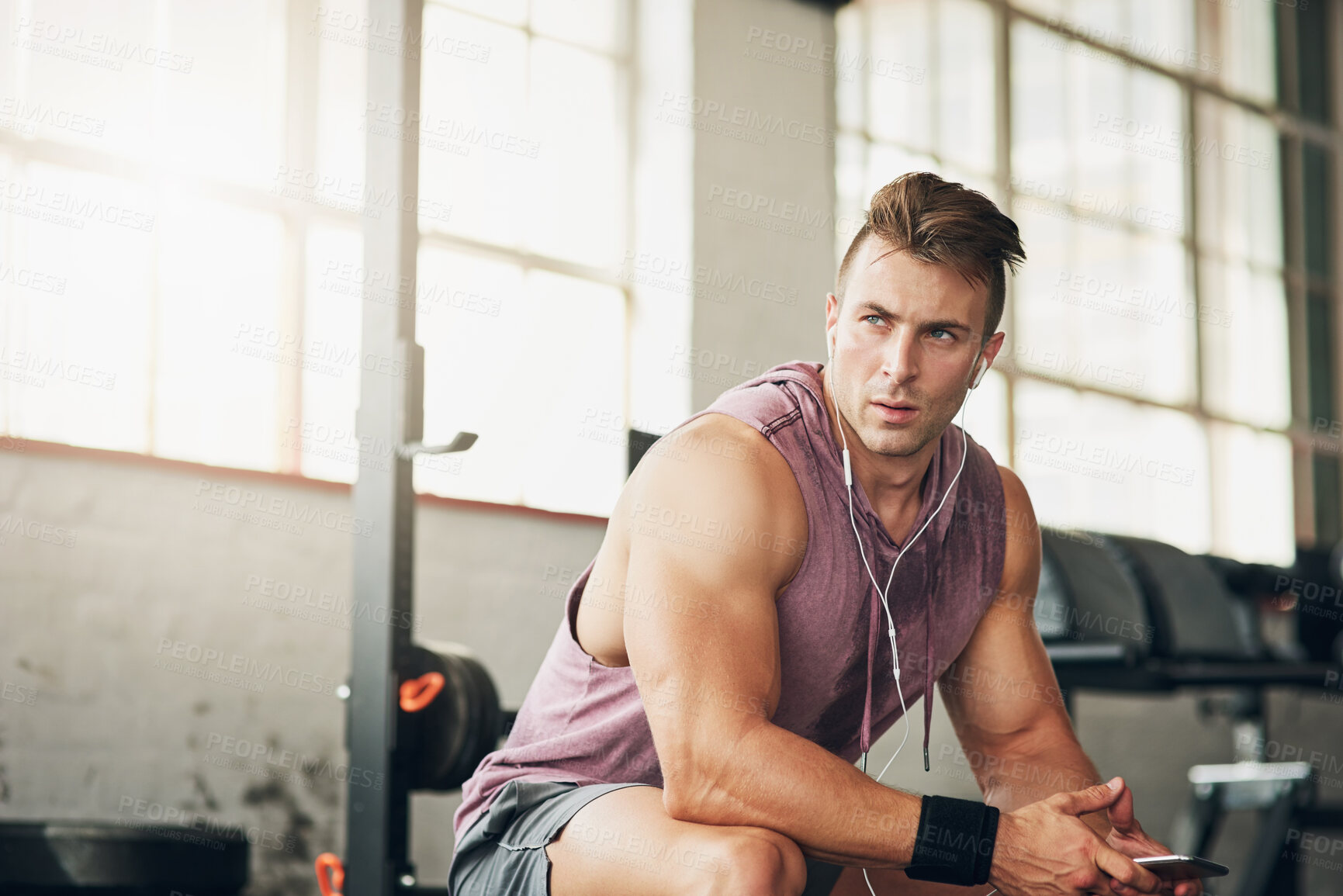 Buy stock photo Shot of a handsome young man at the gym