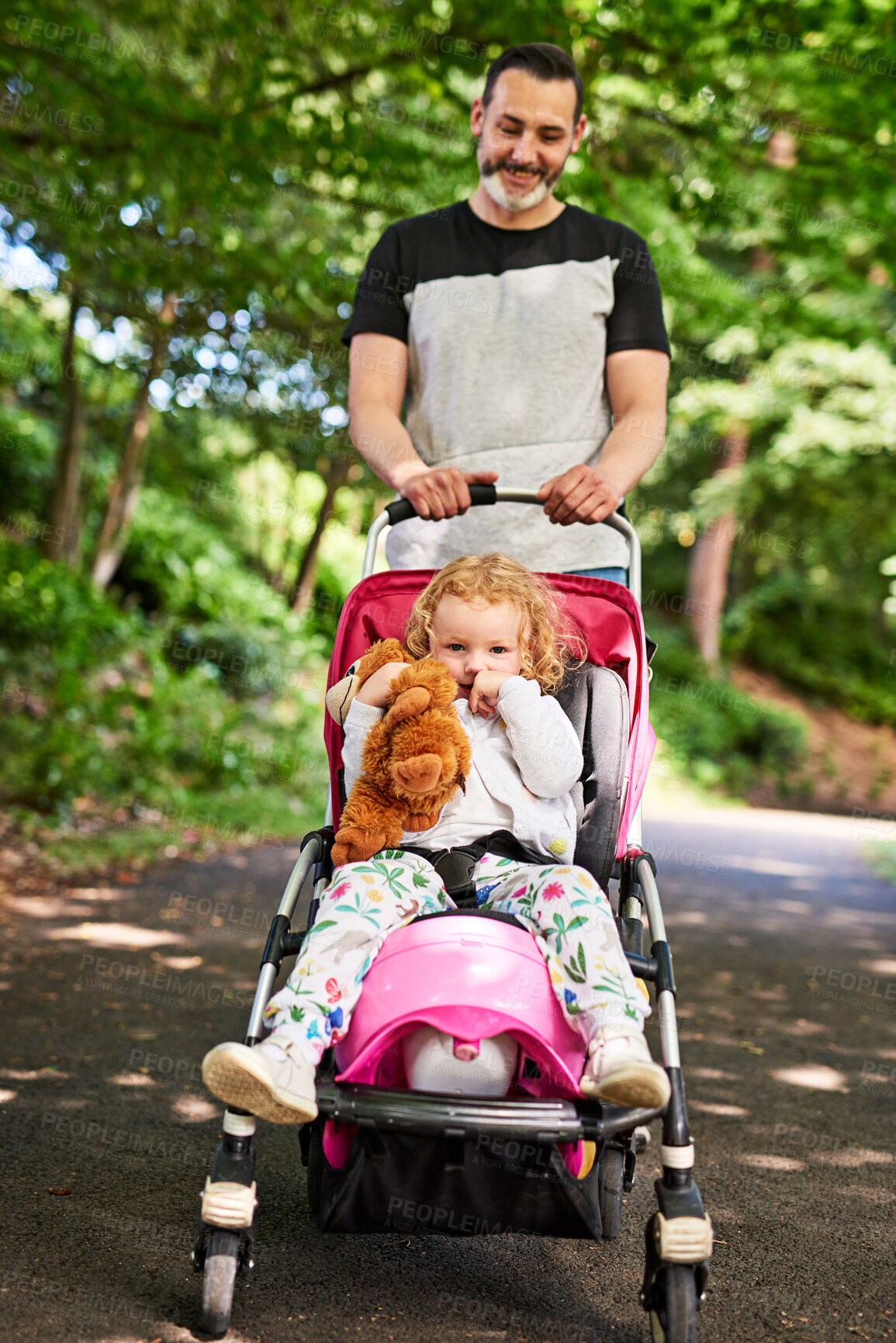 Buy stock photo Stroller, teddy bear and dad with child in nature for walk, journey or adventure together. Pram, outdoor and father with girl toddler kid in park for bonding, connection or family time on path