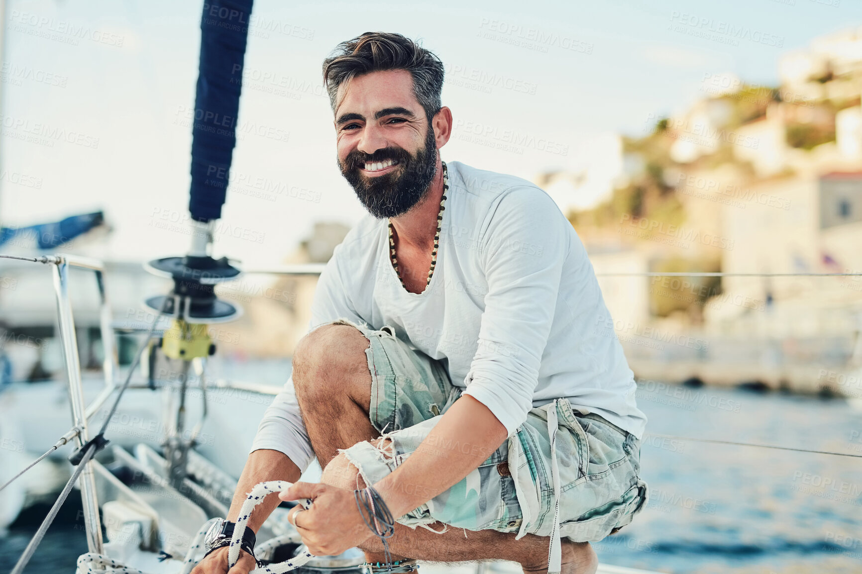 Buy stock photo Portrait, man and smile on yacht for fun, travel and adventure in ocean or sea on summer vacation. Male person, happiness and relax on boat for sailing, holiday and luxury on water with joy in Monaco