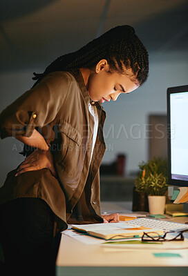 Buy stock photo Night, back pain and sore in office, woman and professional with computer, tired and deadline of reporter. Injury, fatigue and person with burnout, working late and journalist, exhausted and newsroom