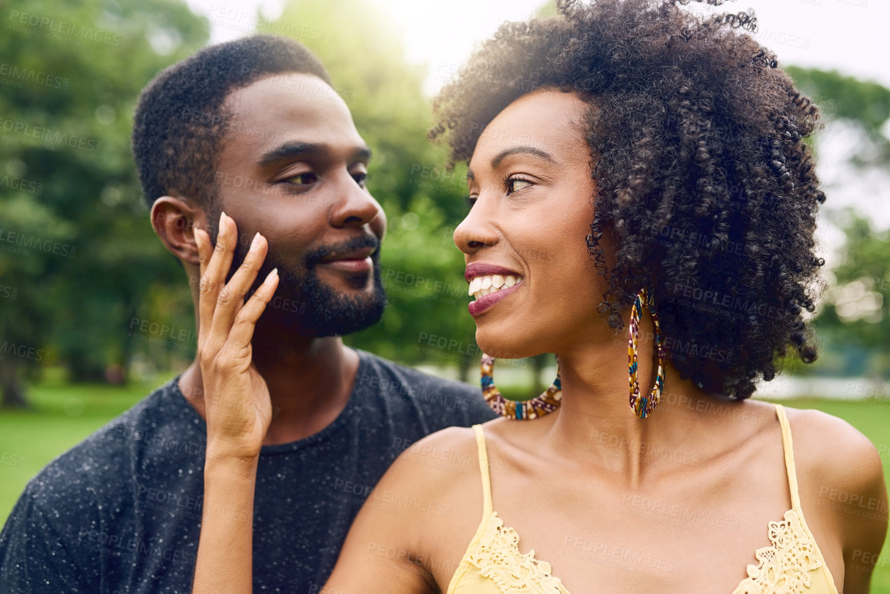 Buy stock photo Park, black couple and dating with love for bonding, admiration and connection together in relationship. Outdoor, man and woman with embrace for commitment, security and happy with trust in nature