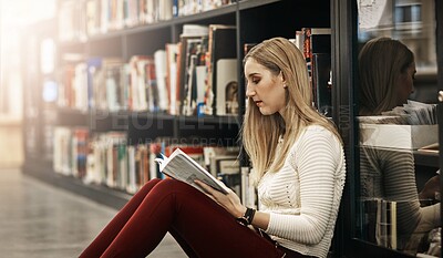 Buy stock photo Revision, student and woman reading book in library for education, learning and study at college. Bookshelf, school or female person for research, course knowledge or scholarship at university campus