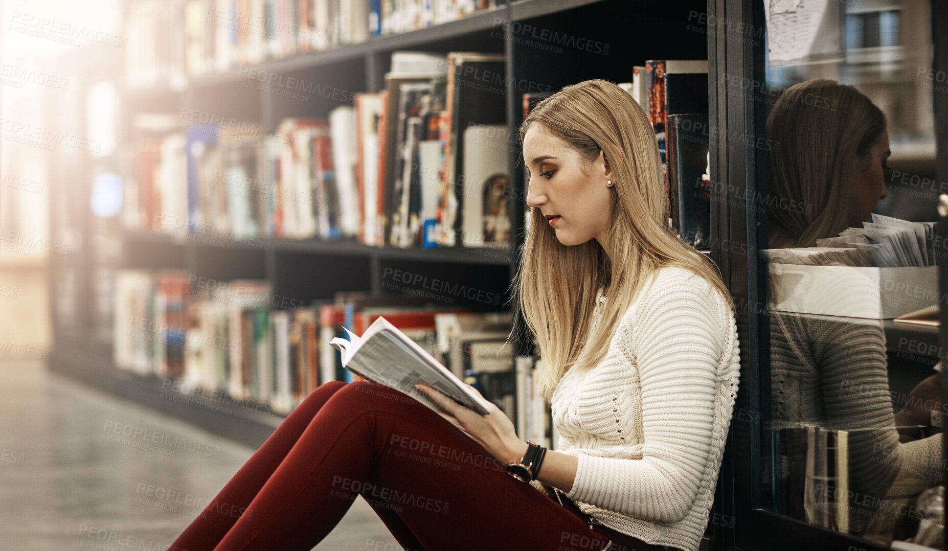 Buy stock photo Revision, student and woman reading book in library for education, learning and study at college. Bookshelf, school or female person for research, course knowledge or scholarship at university campus