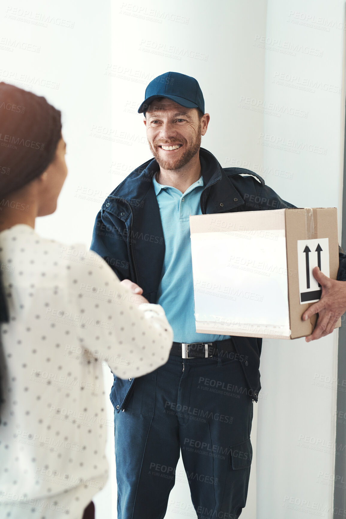 Buy stock photo Delivery man, happy woman or customer shaking hands for box, ecommerce or online shopping. Front door, agreement and people greeting for package, goods or courier mail order for shipping in apartment