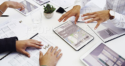 Buy stock photo Cropped shot of a group of businesspeople sitting around the boardroom table during a meeting