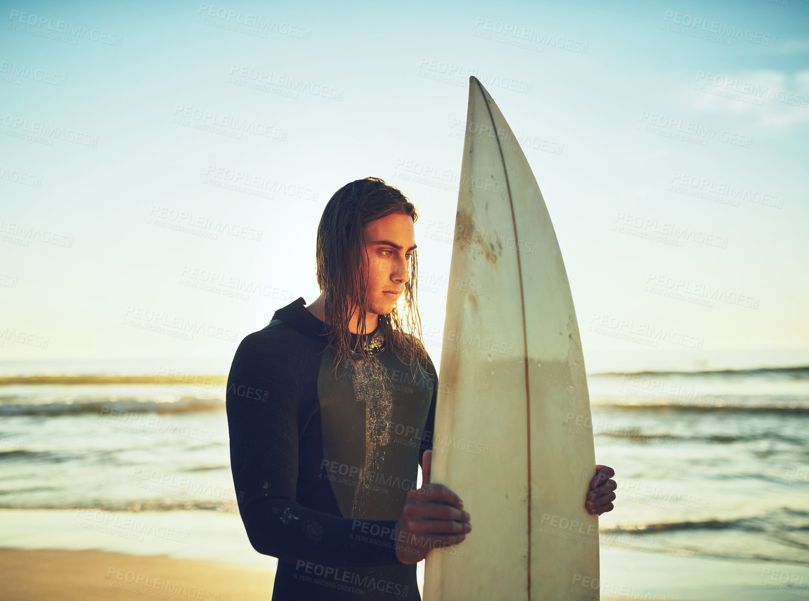 Buy stock photo Man, surfboard and thinking on beach for fitness, training programme and competition preparation. Athlete, surfer and sunset at ocean with sport, recreational activity and reflection in Australia