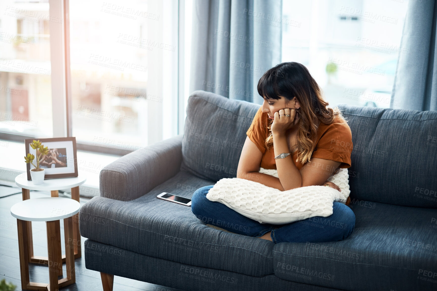 Buy stock photo Breakup, impatient or sad woman waiting for call for relationship stress or anxiety on couch. Depression, lonely and upset girl disappointed by toxic cyberbullying message on phone or mobile in home