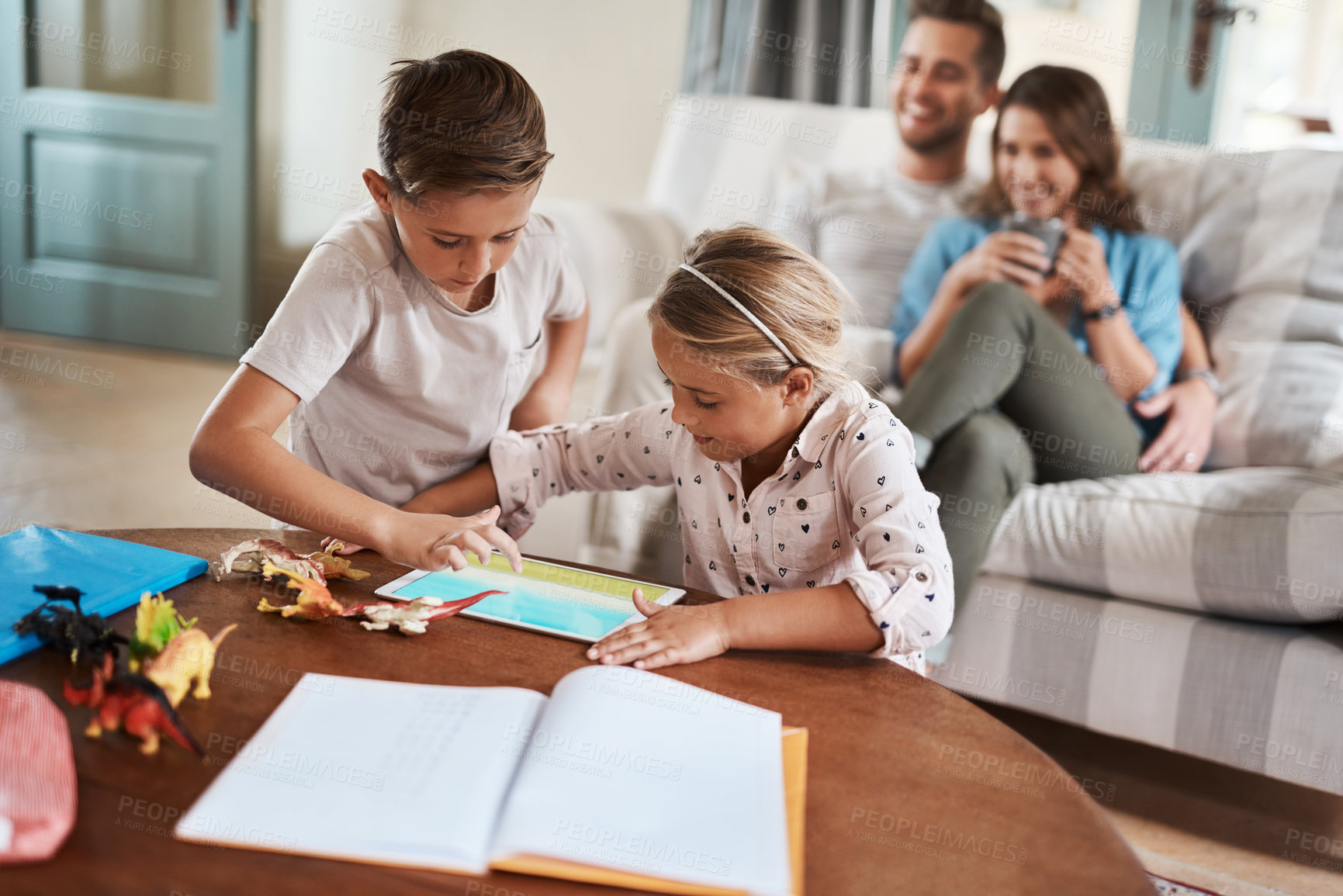 Buy stock photo Tablet, kids and playing with parents on couch with bonding, learning and relax together in living room. Mom, dad and children on sofa with digital app for homework, games or online education in home