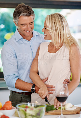 Buy stock photo Married couple, happy or cooking in kitchen for dinner preparation, anniversary or support. Mature man, woman or cutting vegetable in home for healthy meal, milestone celebration or love in marriage