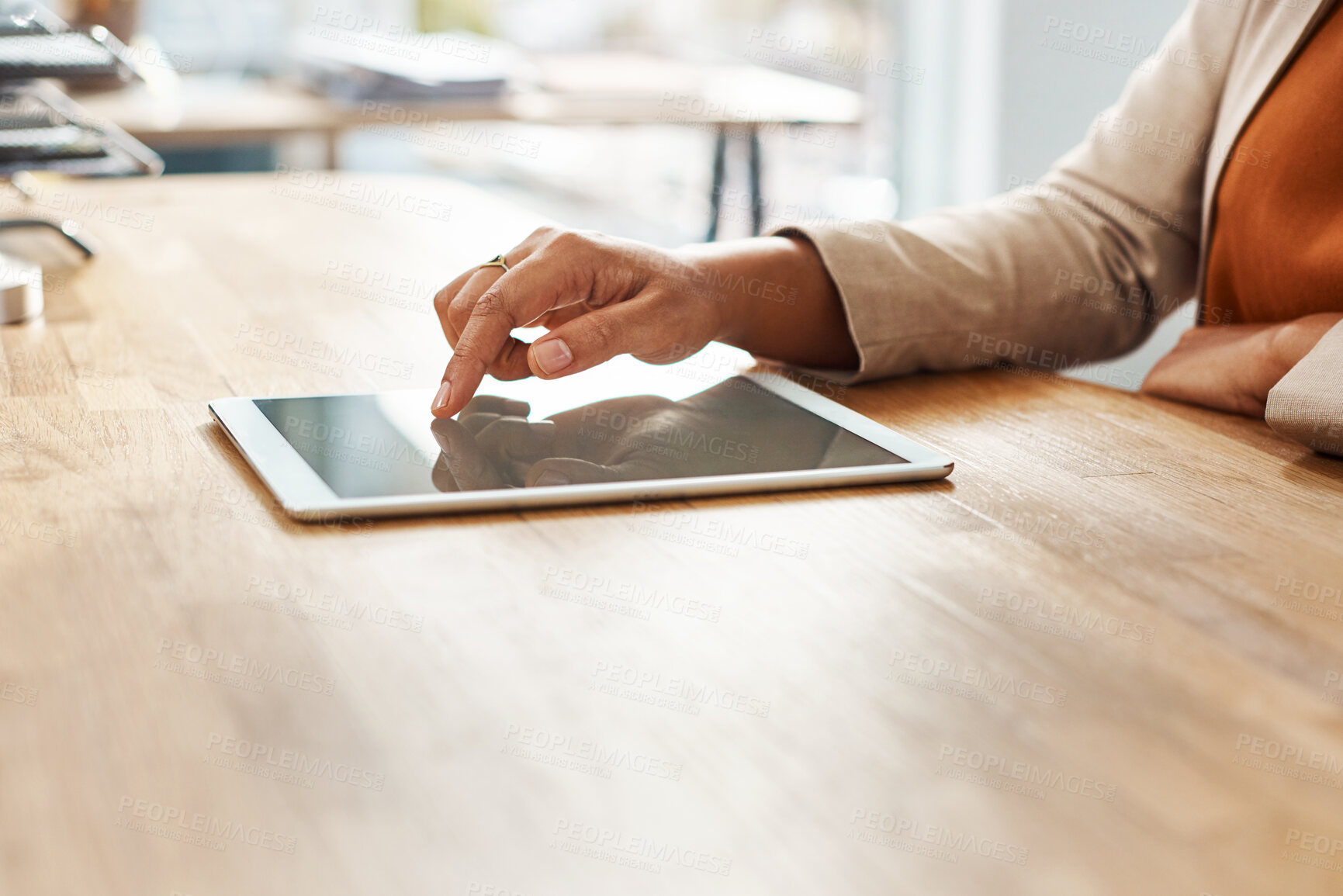 Buy stock photo Hands, scrolling and tablet with business person at wooden desk of office for email, feedback or report. Finger, press for research and technology with corporate employee in professional workplace