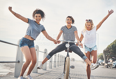 Buy stock photo Bicycle, friends and help with women on holiday for sports, fun and summer break. Health, joy and wellness with cyclists riding bike on promenade for relaxing, Miami travel and freedom together