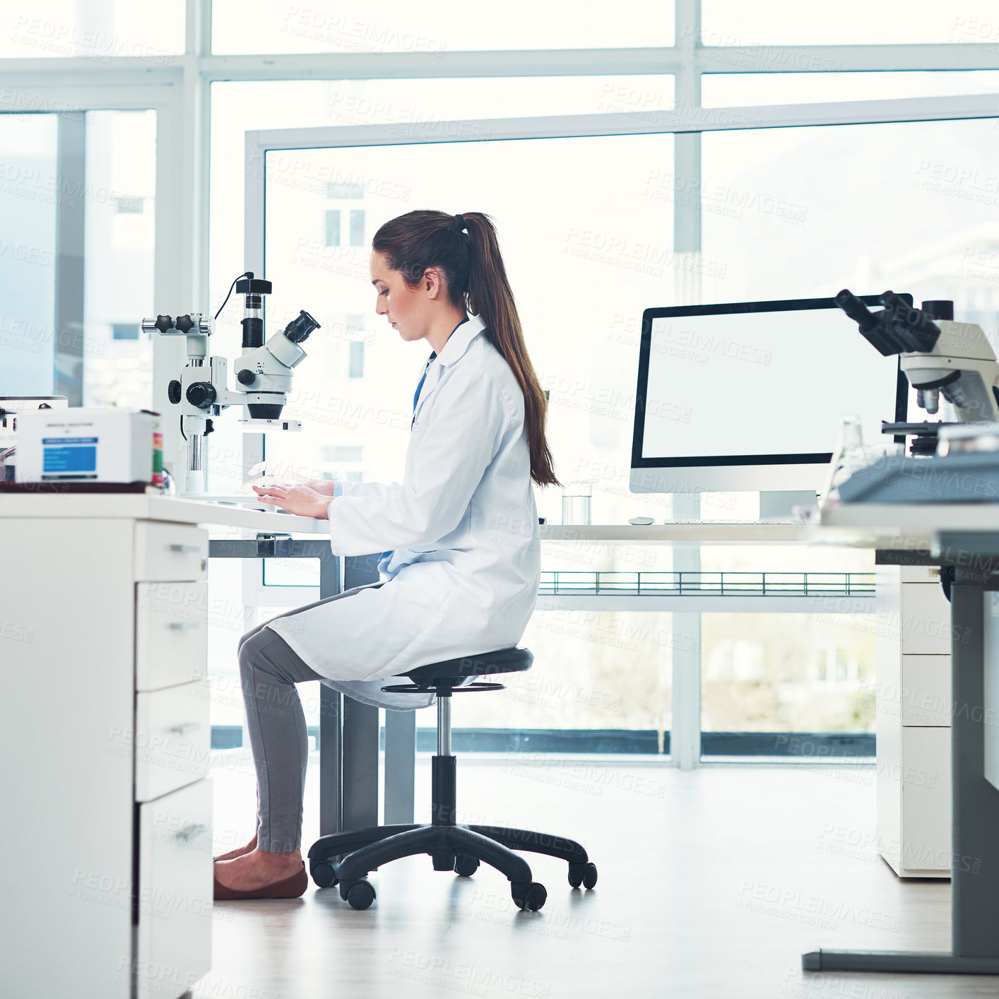 Buy stock photo Woman, scientist and microscope for analysis in laboratory, check sample and studying bacteria. Female person, investigation and medical experiment for disease, biology test and computer mockup space