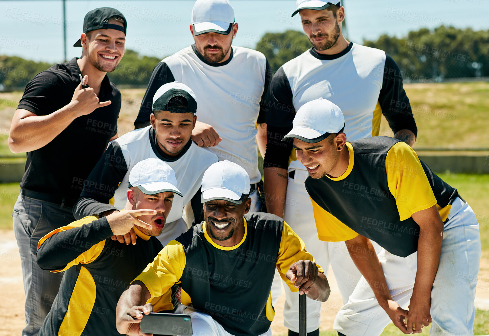 Buy stock photo Cropped shot of a team of young baseball players staking a selfie together while standing on the field during the day