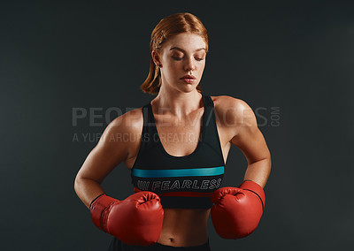 Buy stock photo Woman, boxing gloves and exercise as professional boxer on studio background for fitness or challenge. Female person, athlete and power for fight with strong muscle or pride for championship in sport