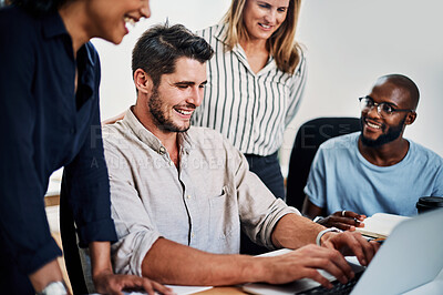 Buy stock photo Cropped shot of an attractive businesswoman helping a female colleague in the office