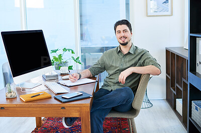 Buy stock photo Portrait of a young businessman working in an office