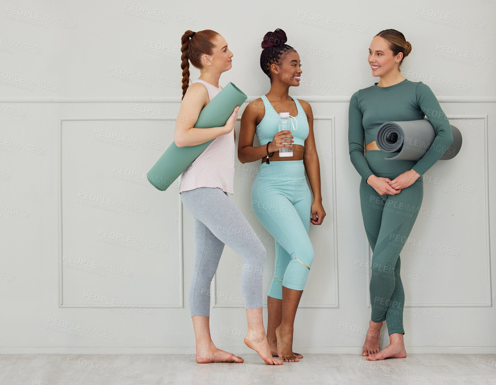 Buy stock photo Yoga, women and conversation with gym mat at wellness, health and pilates studio with friends. Happy, smile and chat with training and fitness fashion with bottle and exercise gear with diversity