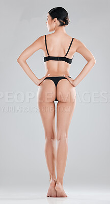 Buy stock photo Full length shot of an unrecognisable woman standing and posing in lingerie in the studio