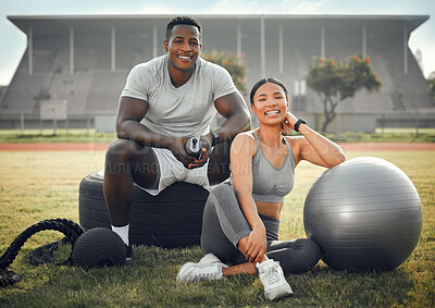 Buy stock photo Cropped portrait of an athletic young couple sitting together outside during their workout