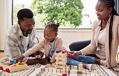 Buy stock photo Black family, play and building blocks with girl learning from parents on floor of living room. Kid, growth and toys for child development with father and mother teaching daughter in home lounge