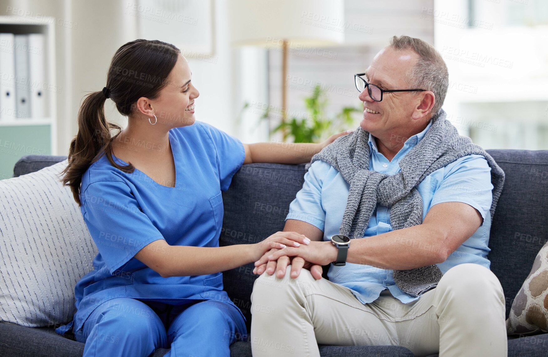 Buy stock photo Senior man, caregiver and helping hand in home for kindness, support and happy on sofa in lounge. Elderly care, nurse and comfort in nursing house for companion, homecare and healthcare with empathy