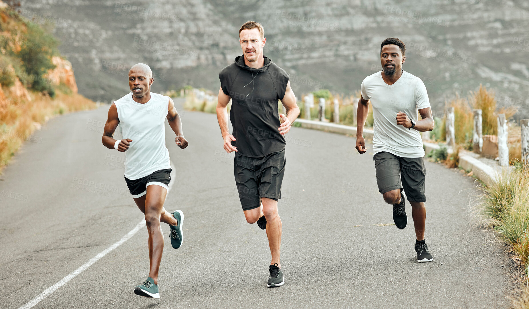 Buy stock photo Shot of a group of men exercising in nature