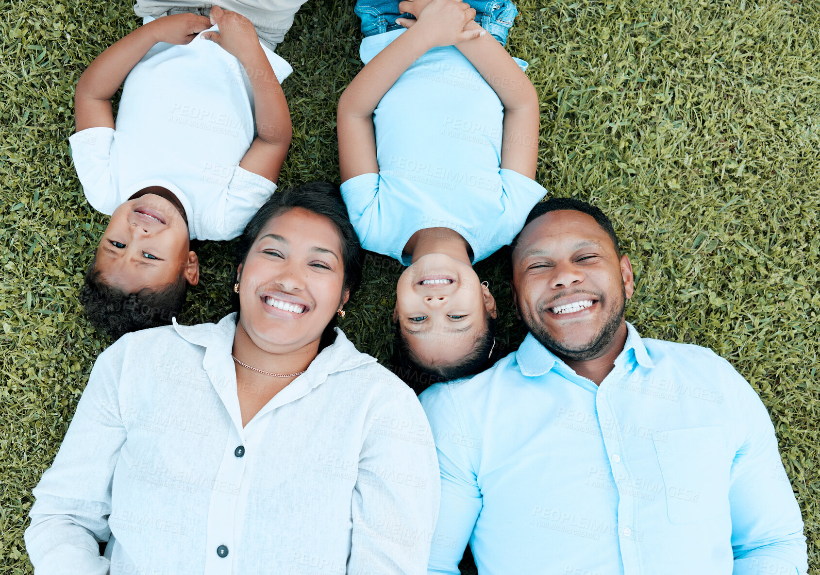 Buy stock photo Family, happy and top view outdoor for bonding, love and solidarity with portrait on weekend break. People, smile and relax on lawn for support, vacation and care with connection, trust and sunshine