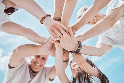 Buy stock photo Family, hands and stack outdoor for support, solidarity and bonding together with blue sky and love. People, low angle and travel outside for teamwork, collaboration and connection with group circle