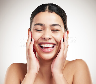 Buy stock photo Skincare, laugh and woman in studio with natural, beauty and facial routine for glow and hydration. Health, happy and female person with face dermatology treatment for hygiene by gray background