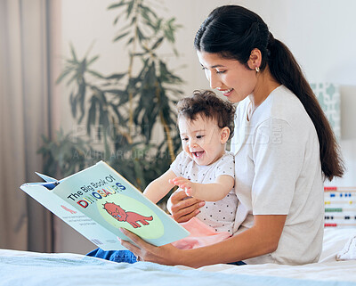 Buy stock photo Mother, baby and reading a book on bed in nursery for child development, learning and knowledge with smile. Motherhood, kid and story in bedroom of home for bonding, infant wellness and storytelling