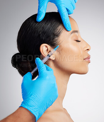 Buy stock photo Closeup of a gorgeous mixed race woman getting derma filler. Hispanic model getting filler to reduce wrinkles against a grey copyspace background in a studio