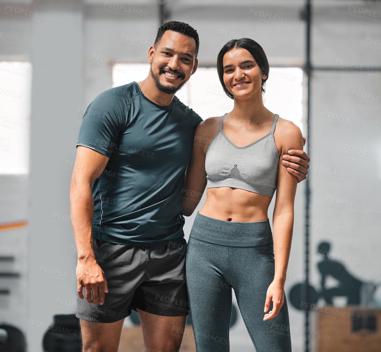 Buy stock photo Happy, active and fit couple training, doing exercise and workout for fitness together at the gym. Portrait of a cheerful, joyful and content boyfriend and girlfriend at a sports center for cardio