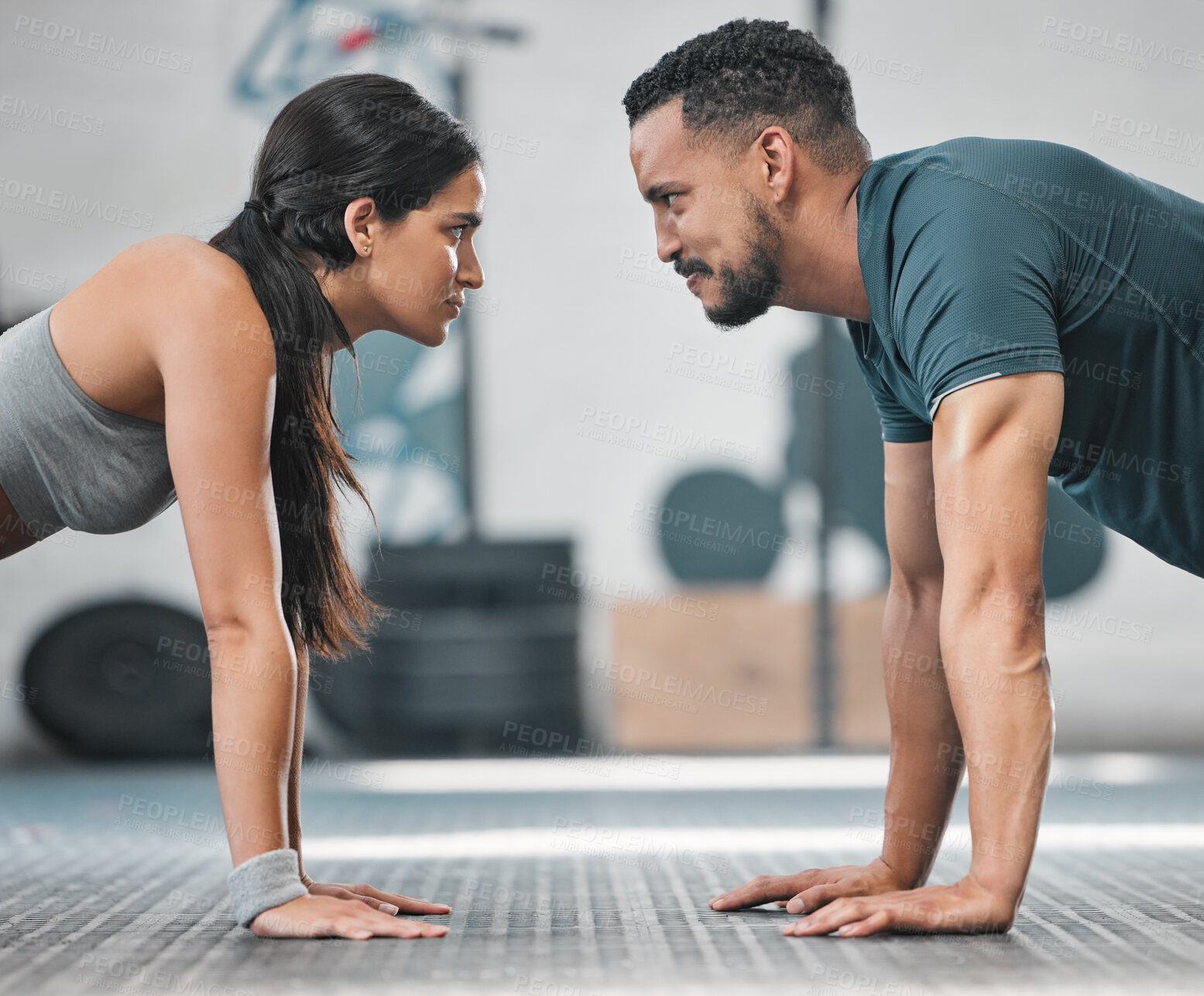 Buy stock photo Fitness, gym and training couple doing an exercise workout and living an active, healthy and sporty lifestyle together. Serious, toned and athletic young friends using teamwork to get a stronger body