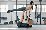 Healthy, fit and active couple doing a workout, exercise and fitness routine for a lifestyle of health. Young boyfriend and girlfriend exercising, training and balancing together inside a gym