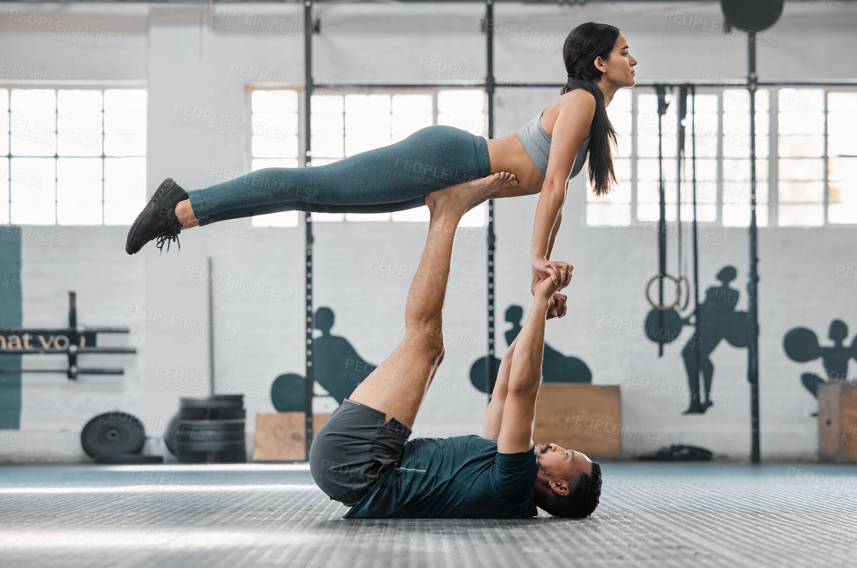 Buy stock photo Healthy, fit and active couple doing a workout, exercise and fitness routine for a lifestyle of health. Young boyfriend and girlfriend exercising, training and balancing together inside a gym