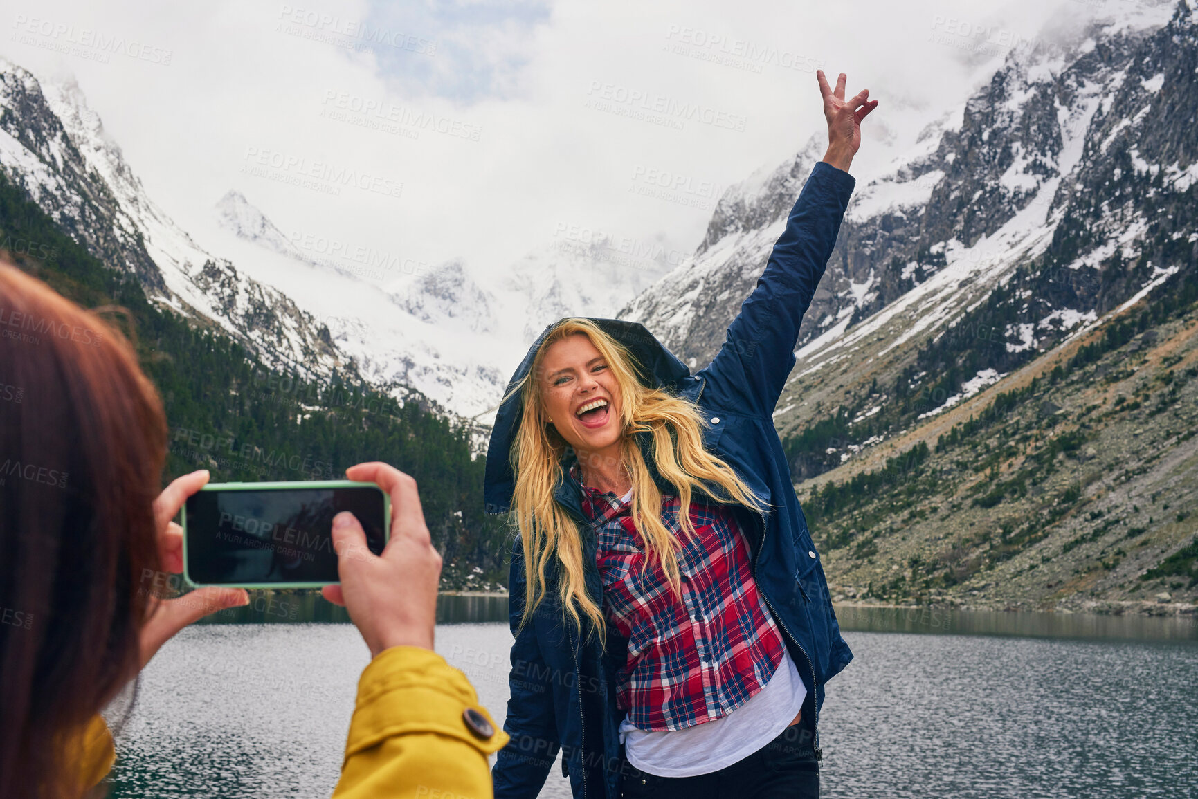 Buy stock photo Lake, women and friends with photography in mountain on hiking adventure for memories in Canada. Happiness, female person and tourist in woods for winter holiday, social media post and traveling