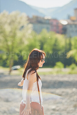 Buy stock photo Happy woman, freedom or holiday with sunglasses in nature for outdoor weekend, travel or trip. Carefree female person, trees and walking in sunlight for tourism, carefree day or adventure on vacation