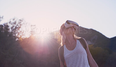 Buy stock photo Hiking, mountain and virtual reality with woman in nature for metaverse adventure, journey or travel. Earth, forest and sky with tourist person in VR headset for holiday or vacation from below