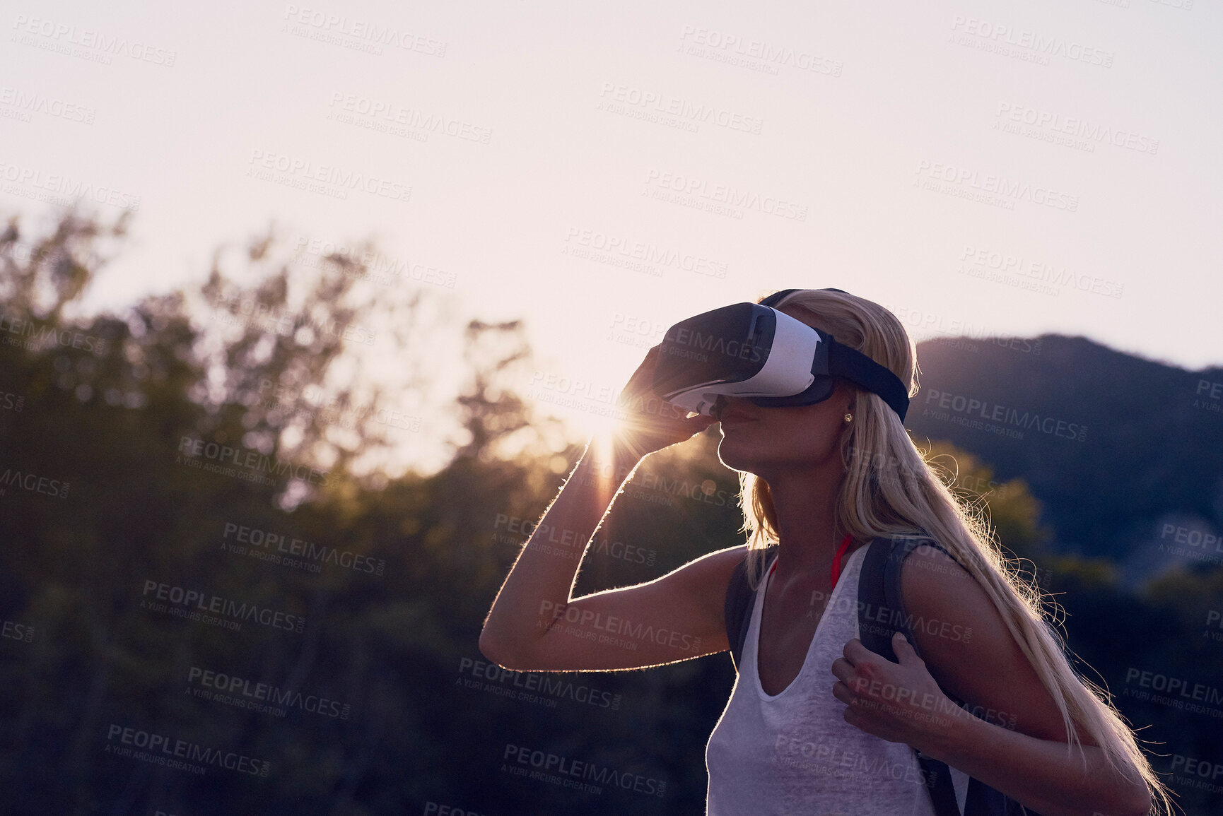 Buy stock photo Hiking, trees and virtual reality with woman in nature for metaverse adventure, journey or travel. Earth, forest and sky with tourist in VR headset for immersive holiday or vacation user experience