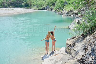 Buy stock photo Women, bikini and back with peace sign by lake for vacation, holiday or outdoor weekend in nature. Female person, friends and joy with emoji or hug for swim, journey or adventure by water or pond