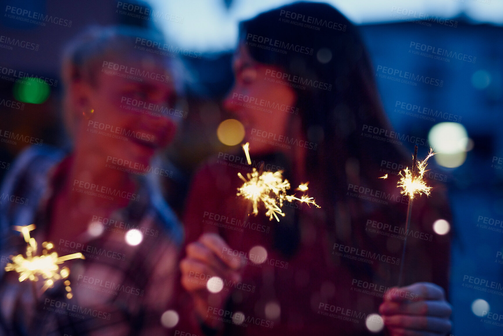 Buy stock photo Happy woman, friends and night with sparklers for celebration, new year or party together in city. Young, female person or women with fireworks in late evening for cheerful holiday or festive season