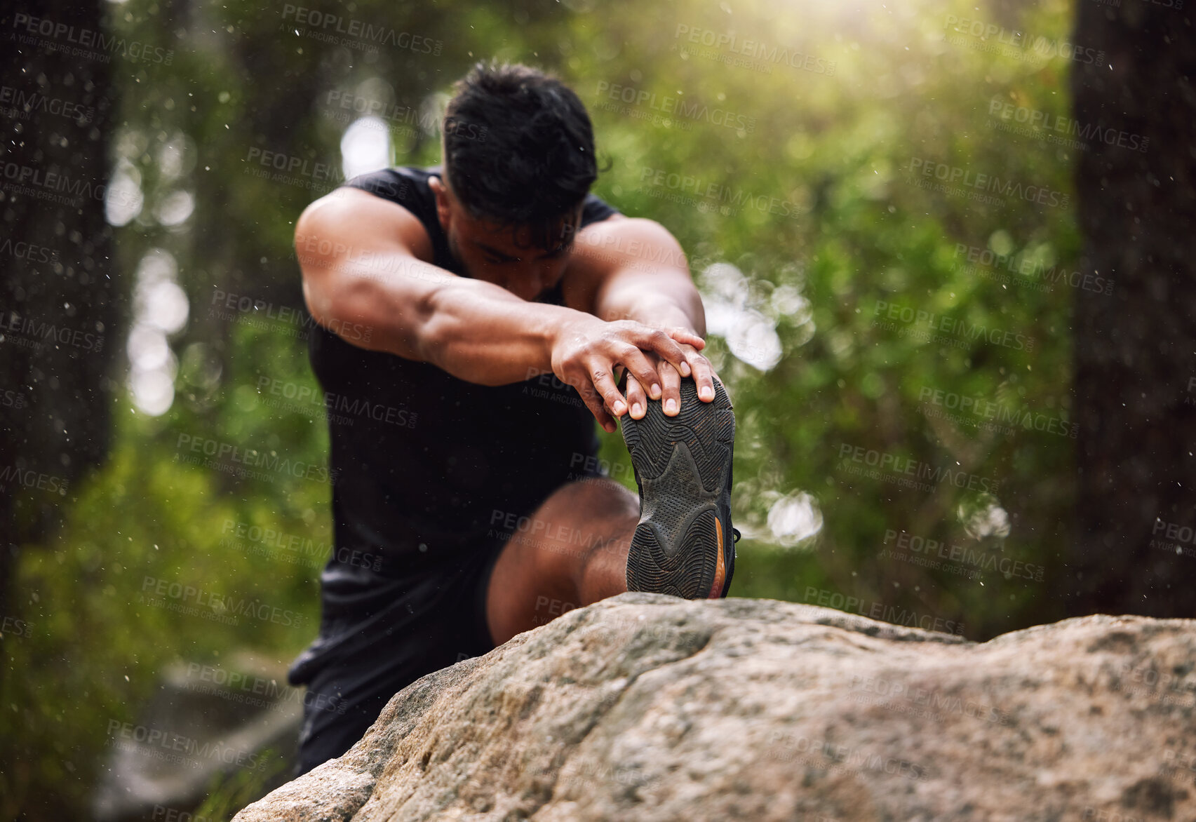 Buy stock photo Leg, exercise and man stretching in forest with fitness workout, health and warm up in morning. Athlete, male person and flexibility in nature with muscle training, routine and preparation for run