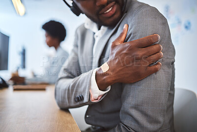 Buy stock photo Black man, hand and call center with shoulder pain or injury for muscle tension, strain or pressure at office. Closeup, young African or consultant with sore joint, arm ache or cramp at workplace