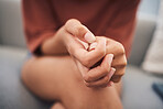 Closeup shot of a mixed race woman hands suffering mental breakdown. Young domestic violence victim afraid and suffering depression and anxiety in a safe house for abused victims of gender violence