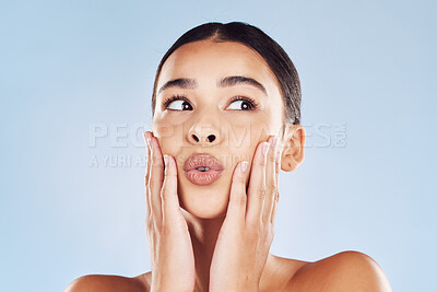 Buy stock photo Model, lips and touch in studio for skincare, beauty and cosmetics with healthy skin, glow and thinking. Woman, vision and hands on blue background for dermatology, headshot and facial transformation