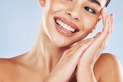 Buy stock photo Woman, smile and closeup in studio for skincare, beauty and cosmetic with healthy skin, glow or texture. Model, mouth and hands on blue background for dermatology, aesthetic and facial transformation