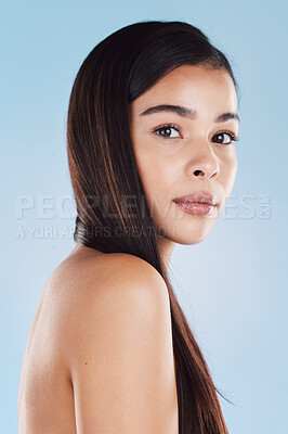 Buy stock photo Woman, portrait and serious for skincare in studio with natural beauty, self care glow or dermatology treatment. Model, girl or pride with skin hydration facial or hair on blue background in Brazil