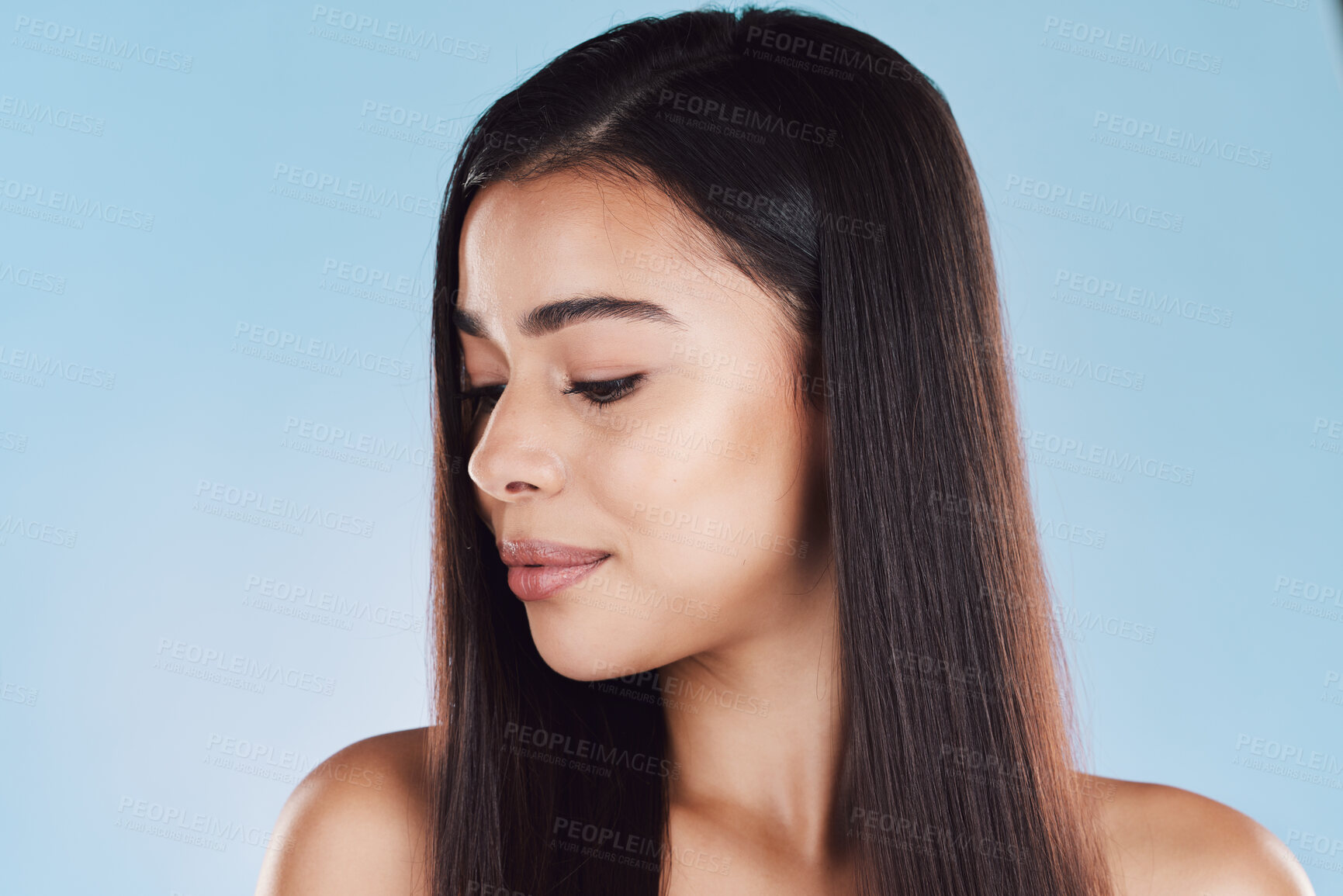 Buy stock photo Beauty, hair and face of woman in studio for salon, wellness and keratin treatment for texture. Hairdresser, spa aesthetic and isolated person with shine, cosmetics and health on blue background